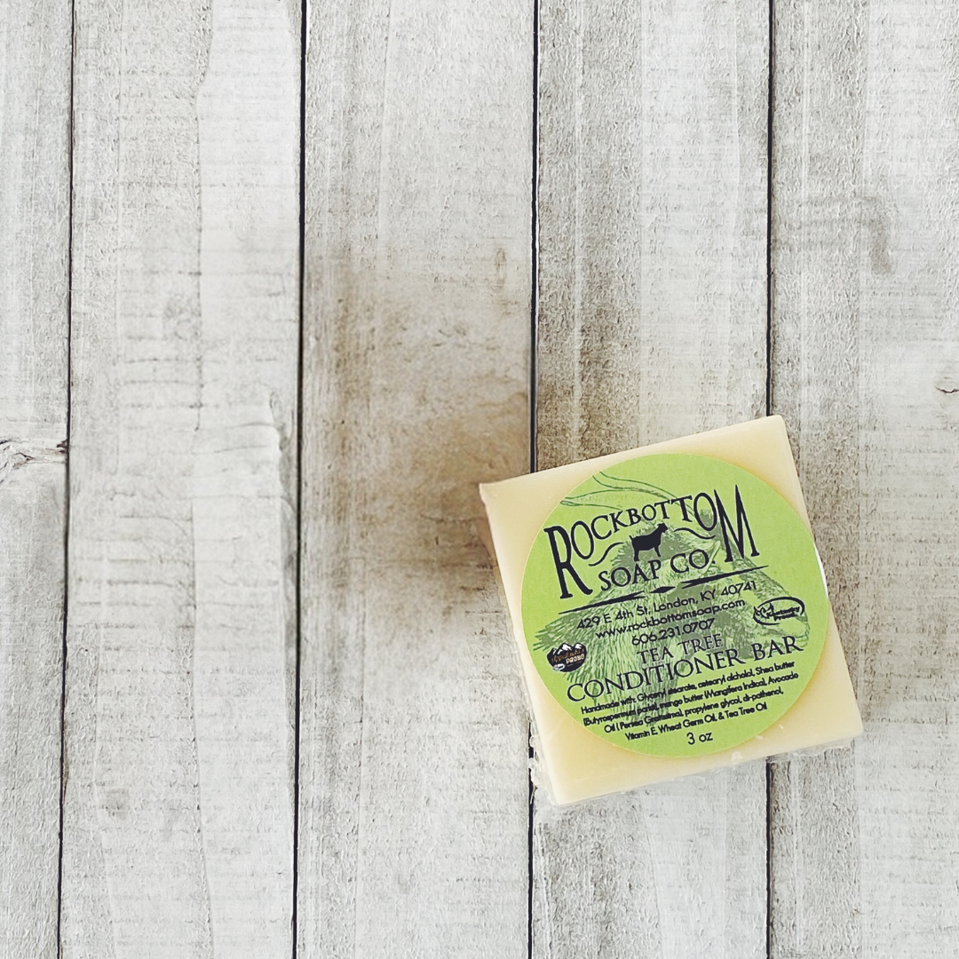 Solid Conditioner Bar on a wooden tray in an outdoor setting – eco-friendly, handmade hair care bar for smooth and moisturized hair