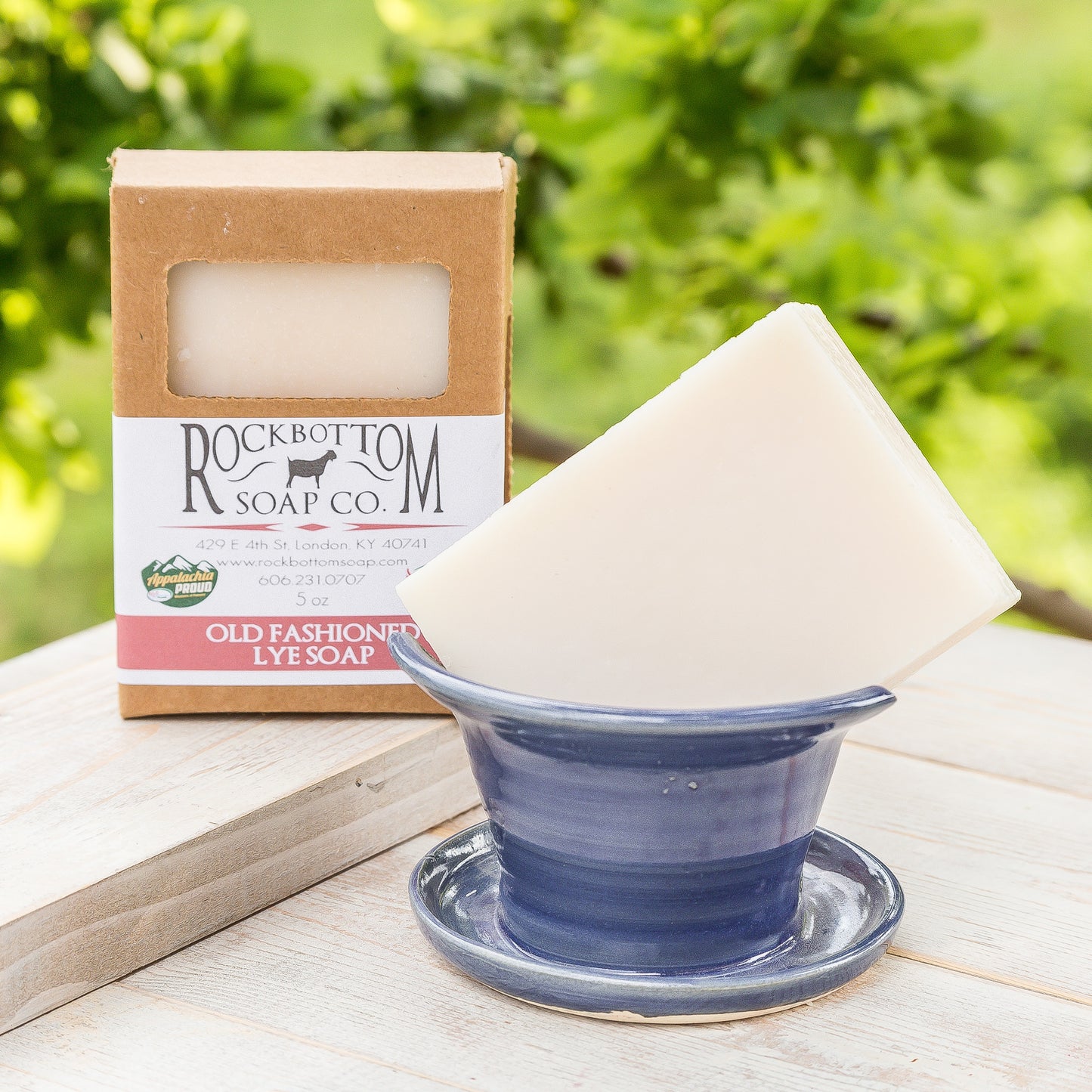 Old-Fashioned Lye Soap on a wooden tray in an outdoor setting – traditional handmade soap bar with a pure, rustic look