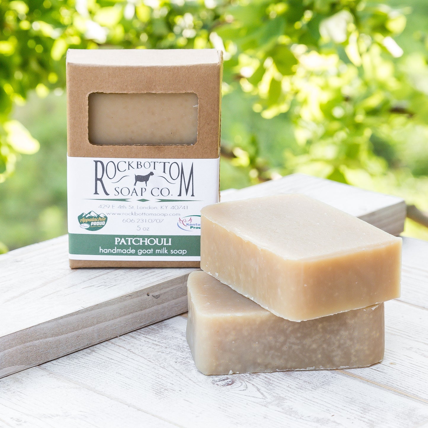 Handmade  Patchouli Essential Oil Soap Bar for refreshing and soothing skin, in an in an outdoor setting on a wooden tray