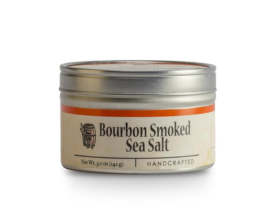 A container of Bourbon Smoked Sea Salt with a label that includes the product name and the phrase 'Handcrafted'.