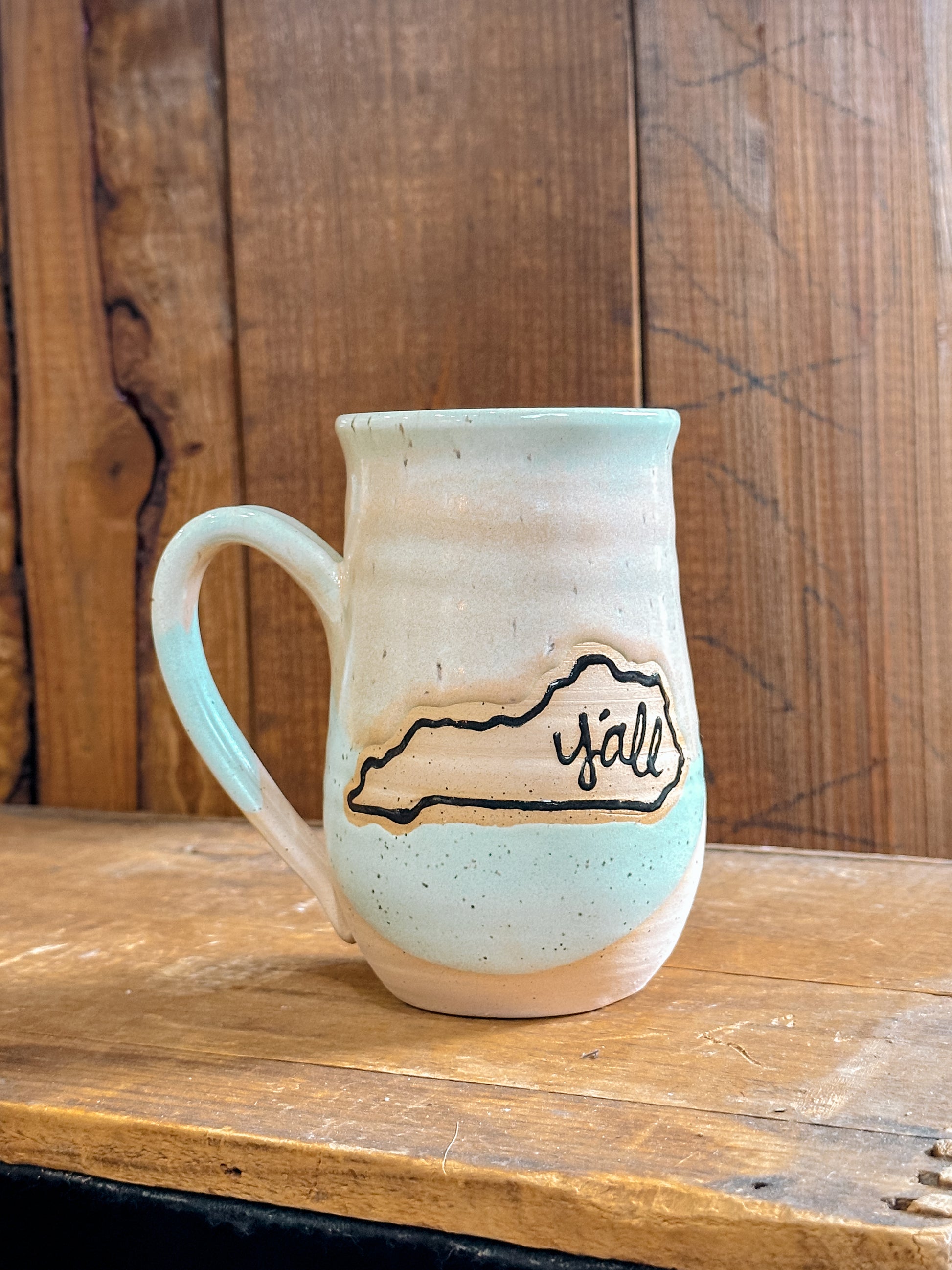 Variety of handmade Slab & Cedar mugs with Kentucky mountains etched on the side – ceramic drinkware with Y'all